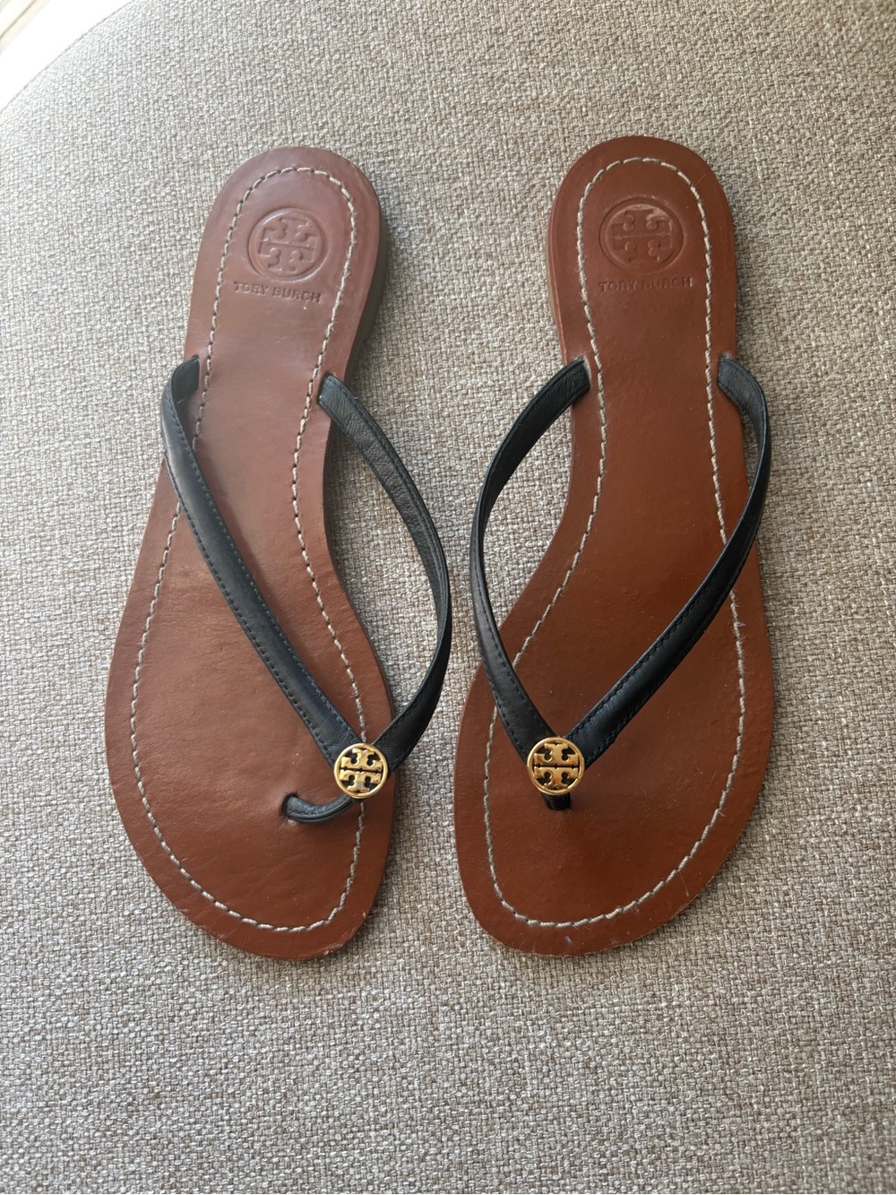 Tory Burch Black Leather Thong Sandals with Gold Logo on Brown Footbed